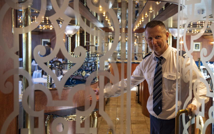2025_Thurgau_Saxonia_Holger_Leue_Crew_web (12) Maître d'hôtel Goran Kruscic welcomes guests at door of restaurant aboard boutique river cruise ship MS Thurgau Saxonia (Thurgau Travel), Wolgast, Mecklenburg-Western Pomerania, Germany
